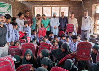 Amrit Charitable Trust, Kochhar Blossom Distribute School Bags Among Meritorious Students in Tral