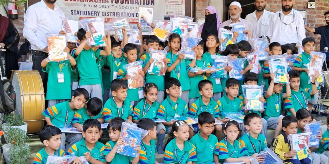Swamagra Foundation Distributes Stationery Kits Among Students in Lurgam Tral