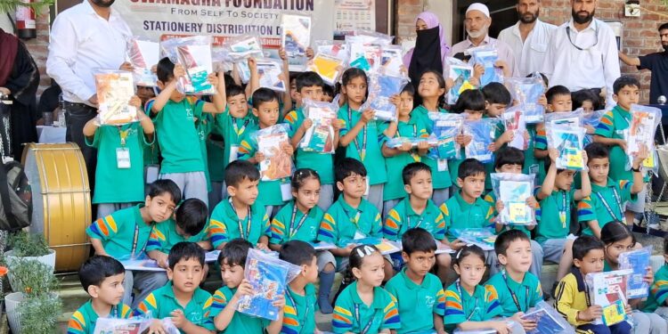 Swamagra Foundation Distributes Stationery Kits Among Students in Lurgam Tral